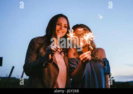 Friends playing with sparklers Stock Photo
