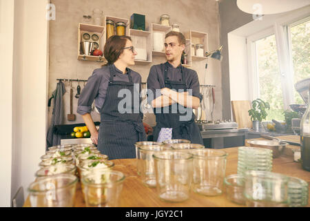 Chefs in kitchen chatting Stock Photo