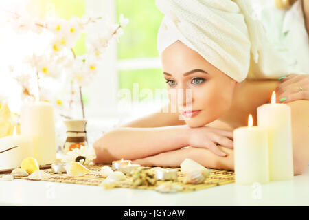 girl lying down on a massage bed Stock Photo