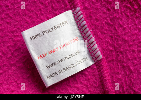 label - 100% polyester keep away from fire made in Bangladesh in girls pink fleece from The Edinburgh Woollen Mill collection of kids clothing Stock Photo