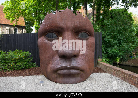 Artist Rick Kirbys Bulkhead mask displayed in the grounds of the The Marlowe theatre, canterbury, kent, uk Stock Photo