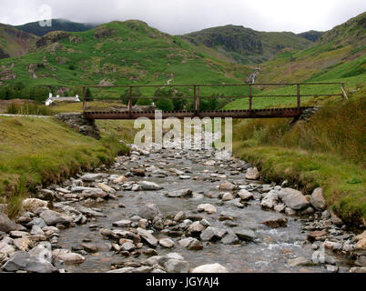 Footbridge over stream, Coppermines Valley, Coniston, The Lake District, Cumbria, UK Stock Photo