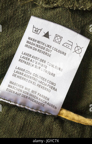 wash care instructions and symbols on label on garment clothing made in ...
