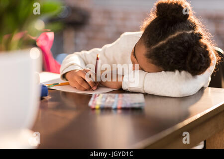 african american schoolgirl doing homework, elementary school student concept Stock Photo