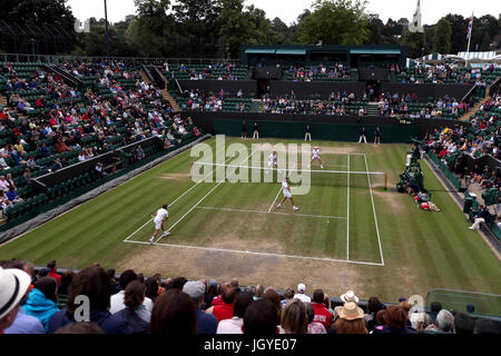 General view of the wear and tear to the grass on the baseline of court two on day eight of the Wimbledon Championships at The All England Lawn tennis and Croquet Club, Wimbledon. Stock Photo