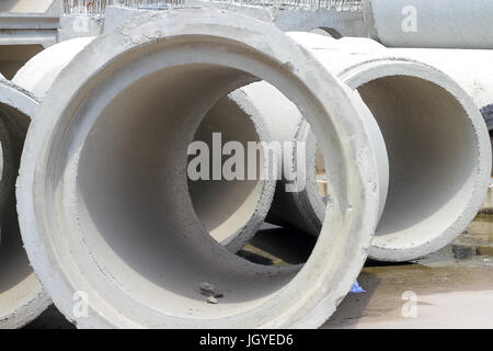 concrete drainage pipes on concrete floor for industrial building construction. Stock Photo