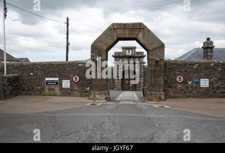 Granite wall and arch at the main entrance to HMP Dartmoor in Princetown Devon UK Stock Photo