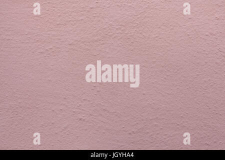 Pink painted stucco wall. Background texture. Stock Photo
