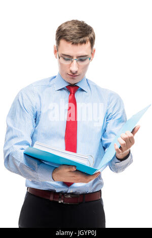 Serious accountant examines important documents in a folder on a white background Stock Photo