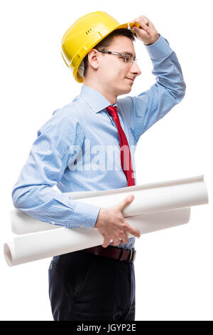 Architect wearing a helmet holding a project drawings on a white background Stock Photo