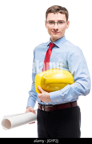 Smiling young architect with glasses with blueprints on white background Stock Photo