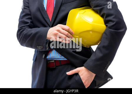 Yellow helmet in the hands of a businessman close-up Stock Photo