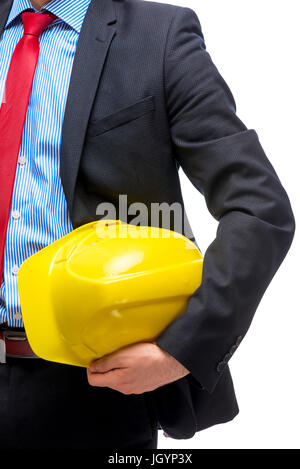 Protective helmet yellow in the hands of the architect close-up Stock Photo