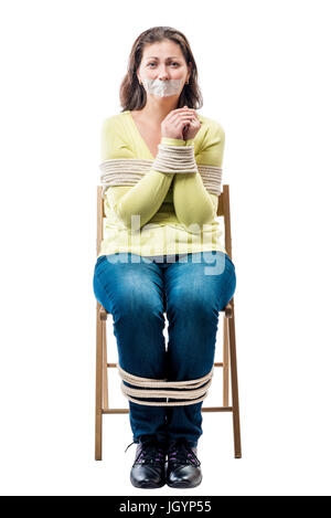 Connected young hostage in a chair on a white background Stock Photo