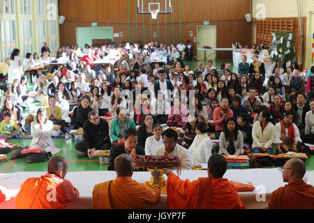Kathina ceremony : the robe offering and other necessities to the monastic sangha. Geneva. Switzerland. Stock Photo