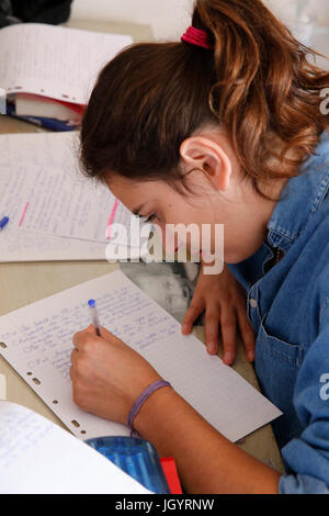 Schoolgirl doing homework. France. Stock Photo