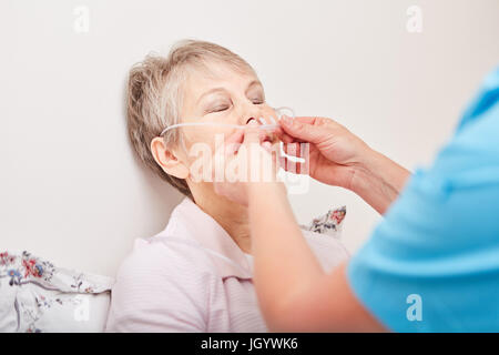 Senior woman as patient with nasogastric therapy Stock Photo