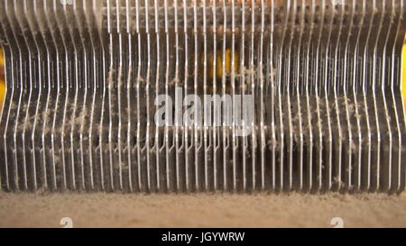 Notebook cooling system cleaning with a brush during service maintenance. Stock Photo