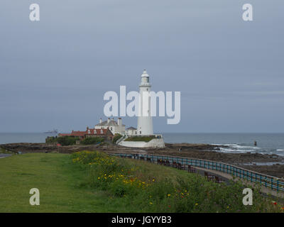 St. Mary's Island Lighthouse, Whitley Bay, Northumberland, tide going out, a ship in the distance Stock Photo