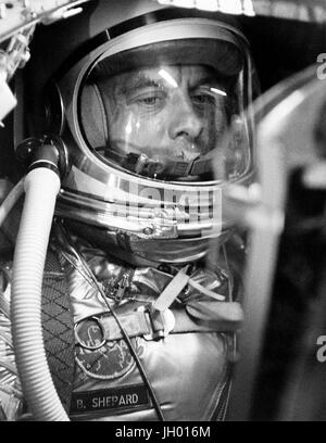 A closeup of astronaut Alan Shepard in his space suit seated inside a Mercury capsule. NASA Photo Stock Photo