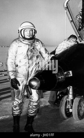 Dryden pilot Neil Armstrong is seen here next to the X-15 ship #1 (56-6670) after a research flight. The X-15 was a rocket-powered aircraft 50 feet long with a wingspan of 22 feet. It was a missile-shaped vehicle with an unusual wedge-shaped vertical tail, thin stubby wings, and unique side fairings that extended along the side of the fuselage. The X-15 was flown over a period of nearly 10 years, from June 1959 to October 1968. It set the world's unofficial speed and altitude records. Information gained from the highly successful X-15 program contributed to the development of the Mercury, Stock Photo