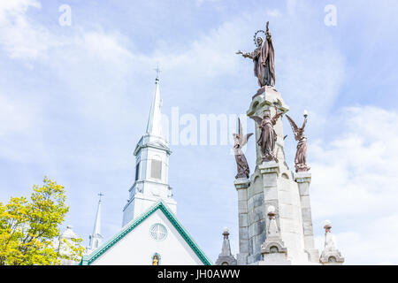 Saint-Augustin-de-Desmaures, Canada - May 29, 2017: Parish of Sainte Augustin in small town on Chemin du Roy with statue of Jesus Christ Stock Photo