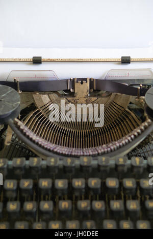 old but gold retro typewriter for old fashioned journalist or reporter. with cyrillic symbols Stock Photo