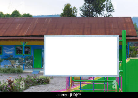 blank billboard in green park field at city park zone. Stock Photo