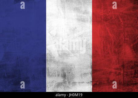 Grunge French flag on concrete wall. Stock Photo