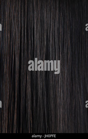 Black hair texture. Wavy long curly dark hair close up as background. Hair  extensions, materials and cosmetics, hair care. Hairstyle, haircut or dying  Stock Photo - Alamy