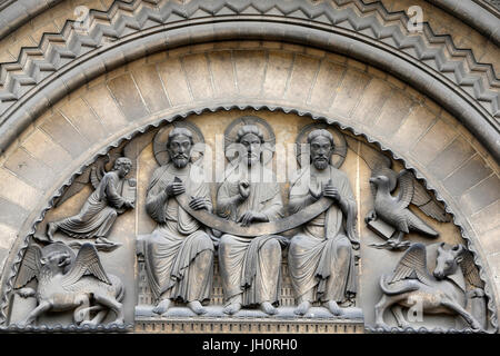 Abbaye-aux-Dames, Caen. Holy Trinity abbey church. Tympanum sculptures. Holy Trinity and symbols of the 4 evangelists. France. Stock Photo