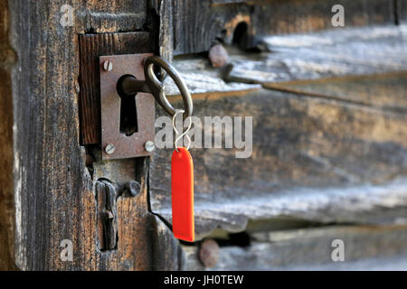 Bionnay baroque chapel.  Old door with key.  France. Stock Photo