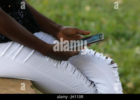 Ugandan woman using a cell phone. Uganda. Stock Photo