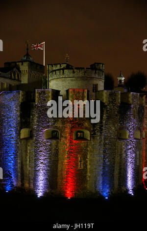 London tower illuminated with the colors of the French flag after the nov.13,2015 terrorist attacks in Paris. United kingdom. Stock Photo