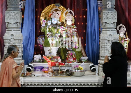 Faithful in Sanatan Mandir hindu temple, Leicester. United kingdom. Stock Photo