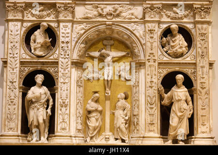 The Victoria and Albert Museum. Altarpiece with the crucifixion flanked by saints. About 1493. Andrea Ferrucci. Italy, Fiesole (Tuscany). Marble. Unit Stock Photo