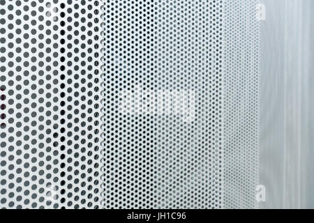 Gray metal background, round perforated metal texture Stock Photo