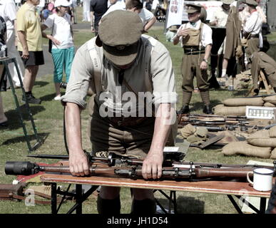 Vintage toned shot of an enthusiast demonstrating a Lee Enfield Rifle Grenade Launcher at a military enactment fair Stock Photo