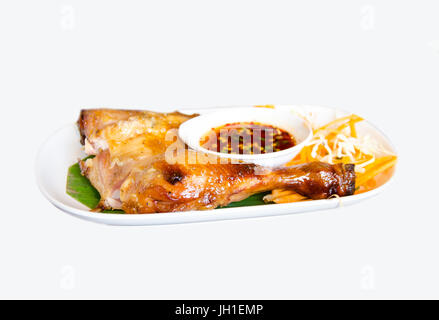 grill chicken with spicy soup on white background Stock Photo