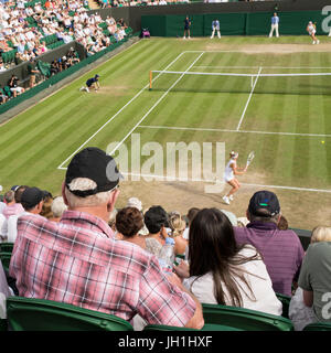 London, UK - July 2017: Spectators watching a tennis match at The Championships, Wimbledon played on court No. 2. Stock Photo