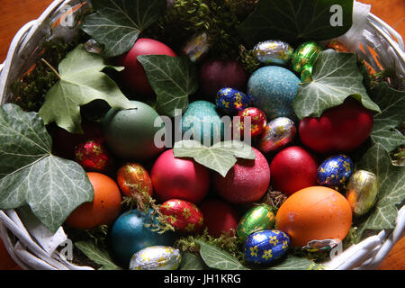 Colorful easter eggs in a basket.  France. Stock Photo