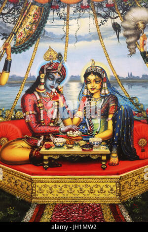 Painting depicting Hindu god Krishna sitting with his consort Radha. India. Stock Photo