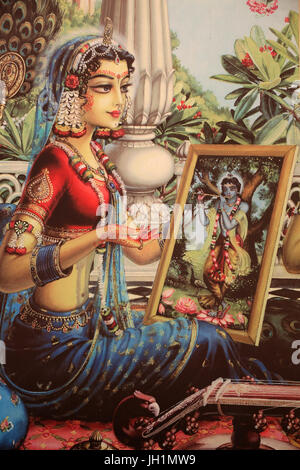 Painting depicting Radha looking at a picture of Krishna. India. Stock Photo