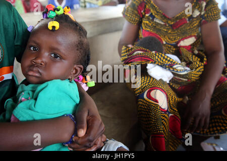 African village life. Woman with her baby.  Lome. Togo. Stock Photo