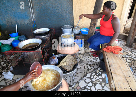 African kitchen. Cassava cooking in oil.  Lome. Togo. Stock Photo