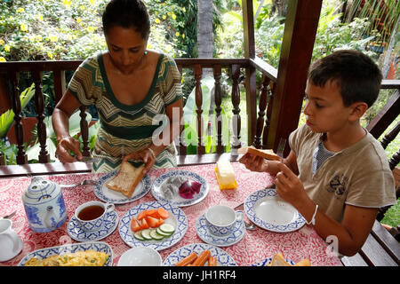 Mother and son having breakfast on holiday in Thailand. Thailand. Stock Photo