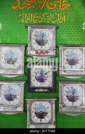 Clocks showing the time all prayers Muslims. Ho Chi Minh City. Vietnam. Stock Photo
