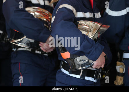 Firefighter and helmet. France. Stock Photo