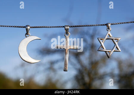 Symbols of islam, christianity and judaism. Stock Photo