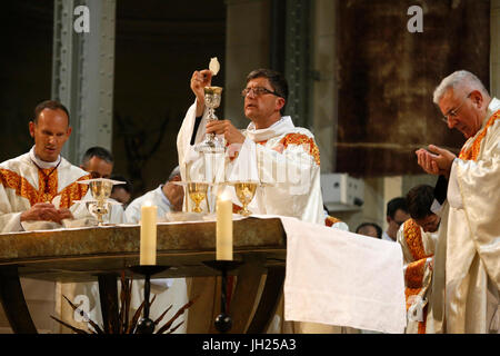 Deacon ordinations in Notre Dame du Travail church, Paris. Eucharist. France. Stock Photo